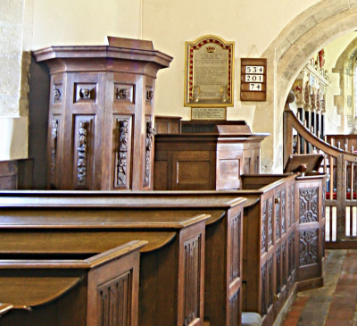 15. Three-decker 17th or 18th century pulpit, with carved saints and cherubs, and the lower clerk's and reader's desks.