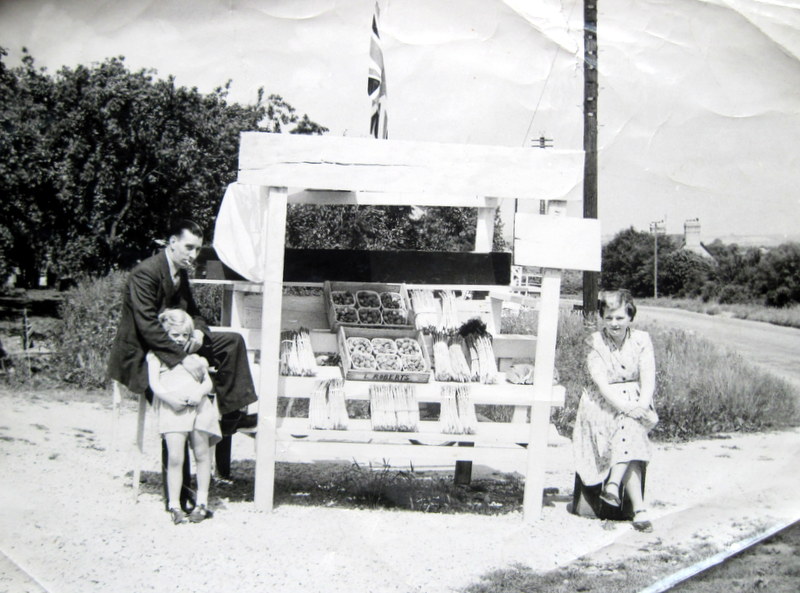 Les Roberts with his daughter, Jane, and wife Barbara (nee Dolphin) selling asparagus and soft fruit in punnets.
