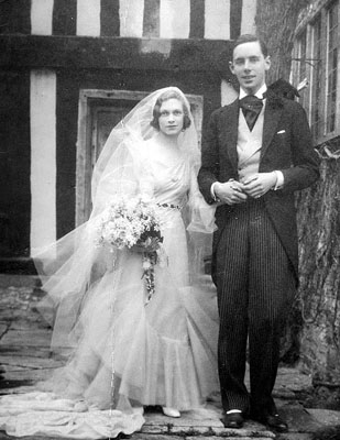 A picture taken outside the Manor on the Wedding Day of Audrey Lees-Milne and Matthew Arthur in 1931. She is seen here with her brother, Richard.