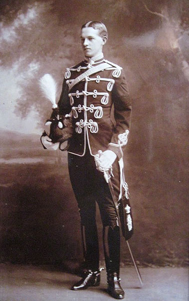 George Lees-Milne (1880-1949) in Hussar's uniform (before he lost his eye). His military service was in the Cheshire Yeomanry from 1901-1905. Yeomanry Regiments had uniforms based on regular cavalry design, usually Hussars but sometimes Lancers or Dragoons.