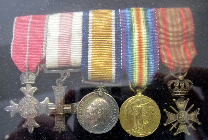 This set of miniature versions of his medals are, from the left, M.B.E., M.C. British War Medal, Victory Medal, the Belgian Croix de Guerre