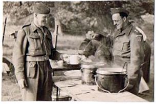 3. Bert Collett of Wickhamford (left) being fed whilst on exercises.