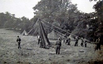 Erecting tents at a Tyddesley Wood camp