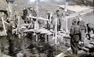 Pioneer Platoon building a bridge over the boating lake in Abbey Park, Evesham