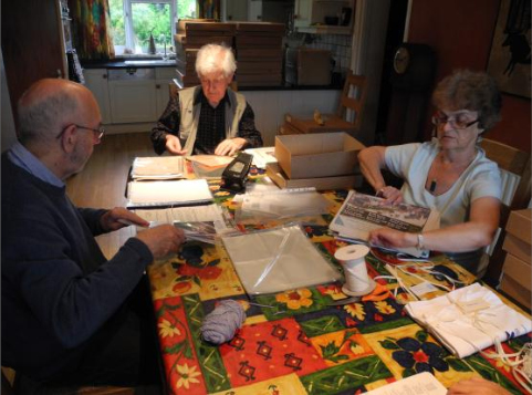 Tony & Avril Wood and Trevor Hockenhull boxing up the archives.