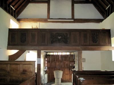 11. Choir gallery with panelled front - taken down in the 1890s and restored in 1949 by George Lees-Milne.  The outer carved panels are figures of saints that may be of continental origin.