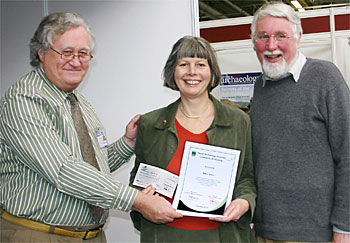 Brian Marsh OBE presenting the award to Maureen Spinks and Richard Phillips. 