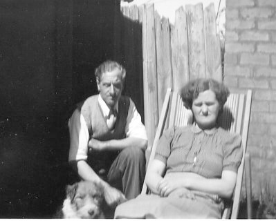 Rouben John (known as Jack) and Elisa Bennett and their dog, in the garden at 48 Willersey Road