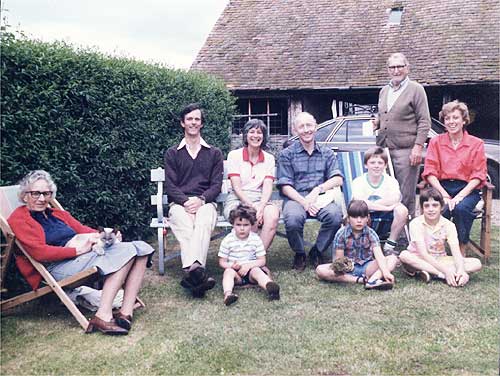 A Miller/Sladden family group sitting outside the barn about 1984.