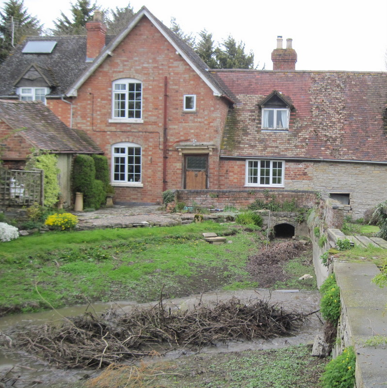 The leat in the foreground and the entrance to the wheel pit in the mill in 2012.