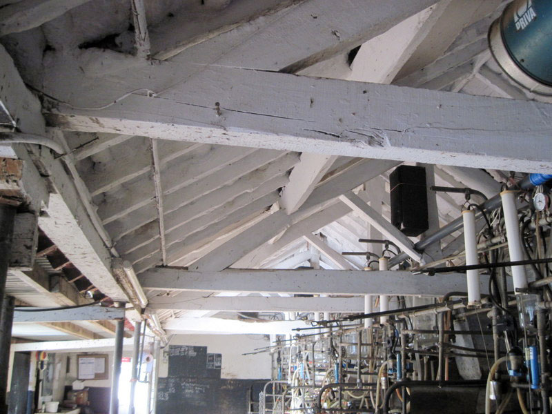Roof trusses inside the 1812 building of cow stalls