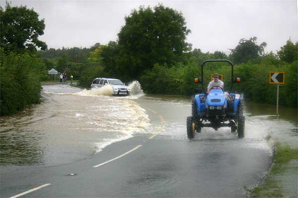 Birmingham Road (1 of 2). When these photos were taken on Saturday morning, the water had gone down enough for Badsey Road and Bretforton Road to be open to traffic. But other routes like this one were still deep in water. Photo: Richard Phillips.