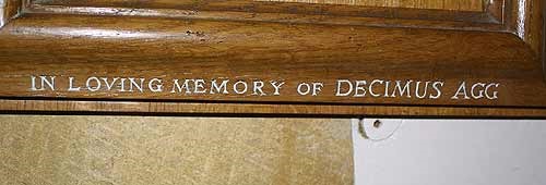 "In loving memory of Decimus Agg" (hymn board inscription)
