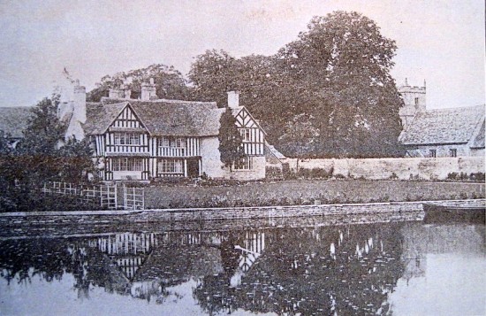 The East front of the Manor House in around 1901. The wall separates the Manor grounds from the Church and until the 19th Century a stone barn stood in that vicinity. Its stones may have been used to construct the wall.