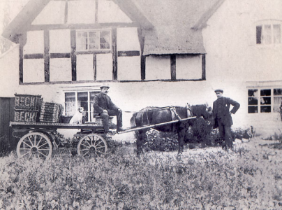 Robert and Arthur Heritage outside Elm Cottages.