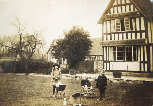 Three children in Manor Garden. The Lees-Milne children - Audrey, Richard & James - in the garden of Wickhamford Manor, 1913 