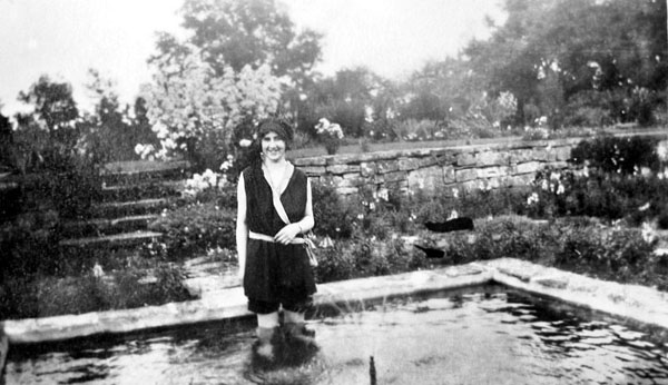 Vera Knight paddling in the ornamental pond in the sunken garden.