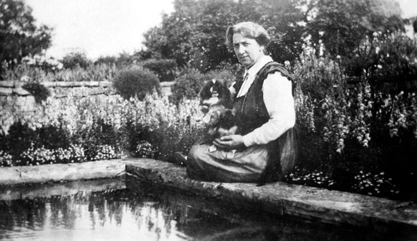 Esther sitting by the sunken garden pond.