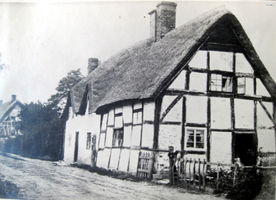 The pair of thatched cottages next to what is now Corner Cottage in the background.