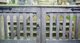 Carved across front gates