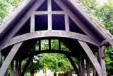 Carved above Lych-gate