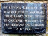 Bronze Plaque on outside wall to the left of Lynchgate