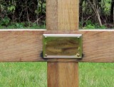 Plaque on wooden cross